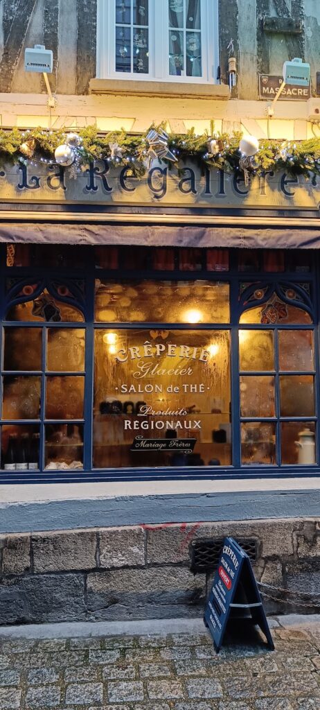 A Galette Shop in Rouen, with misted windows and cosy lighting