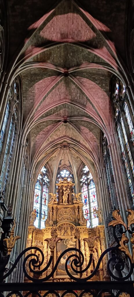 The interior of Rouen Cathedral, in a traditional gothic style with high, pointed ceilings