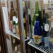A fridge full of bottles of sake in a sake bar in tokyo