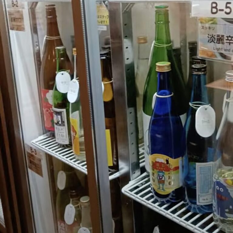 A fridge full of bottles of sake in a sake bar in tokyo