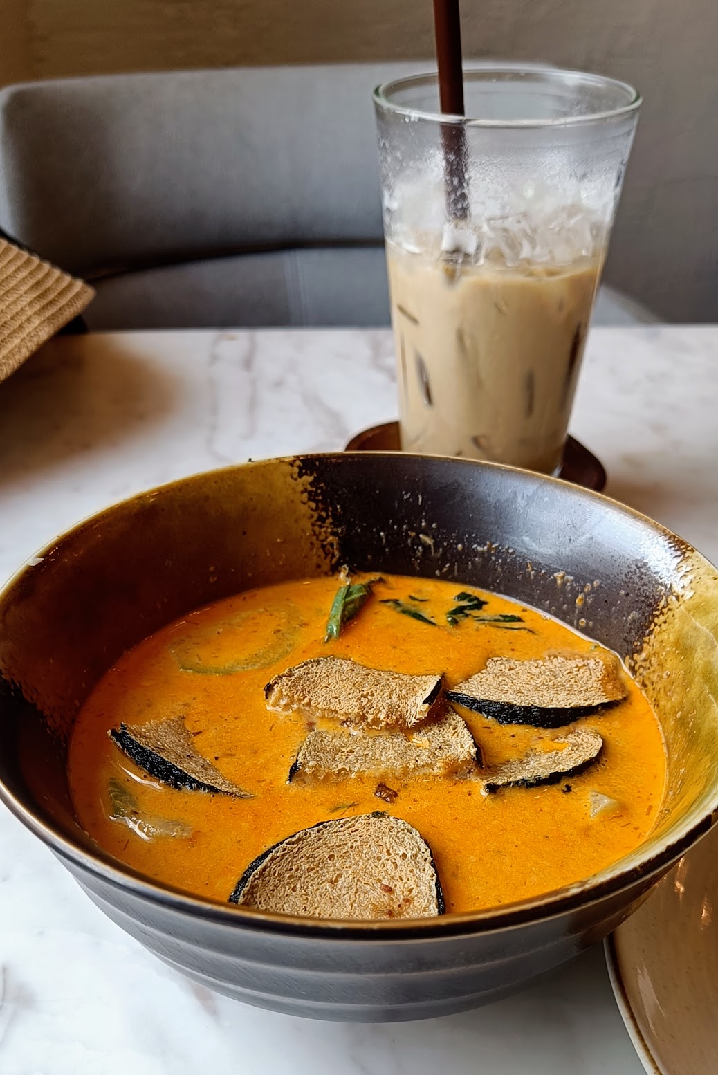 Vegan thai red curry and iced latte at Kem Kon, Bangkok