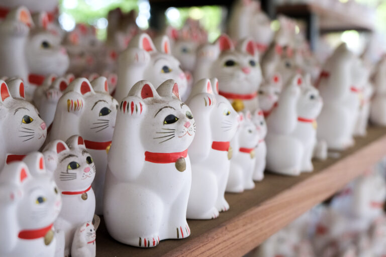 Thousands of beckoning maneki neko at Gotokuji Temple