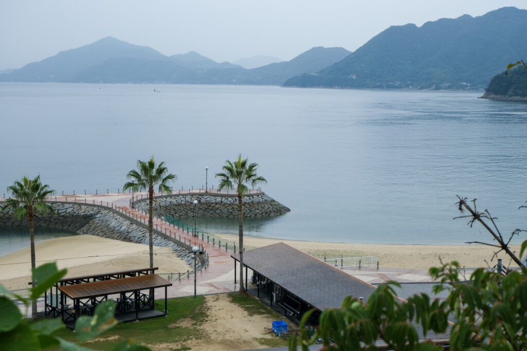 Serene beach with distant mountains on the Shimanami Kaido