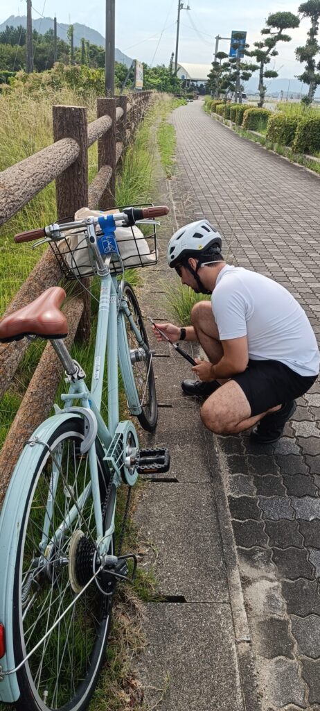 Fixing a Shimanami Kaido bike rental at the side of the road