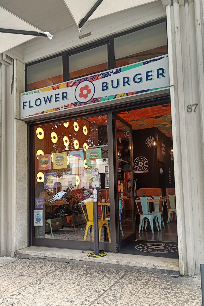The facade of Flower Burger in Verona, a casual vegan burger restaurant