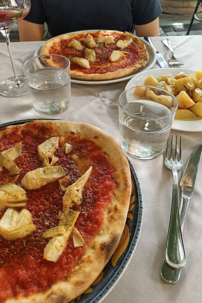 Two pizzas and a side dish