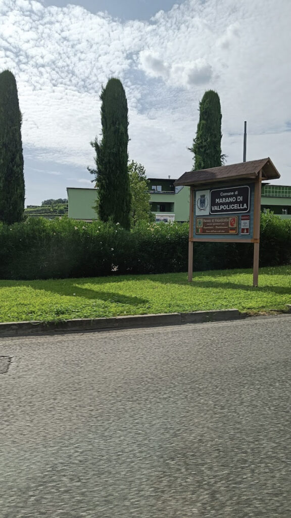 Welcome to Valpolicella sign at the side of the road in Italy