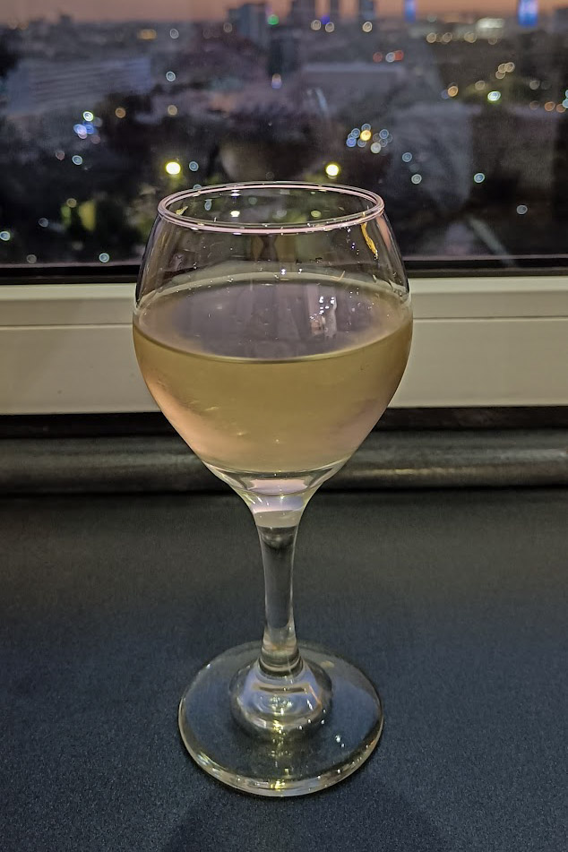A glass of Uzbek wine in the windowsill of the bar in the Hotel Uzbekistan