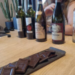 Wine tasting at Farina winery in Valpolicella, with chocolate to accompany the wine bottles - one to factor into your Valpolicella budget