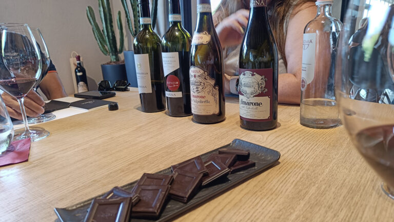 Wine tasting at Farina winery in Valpolicella, with chocolate to accompany the wine bottles - one to factor into your Valpolicella budget