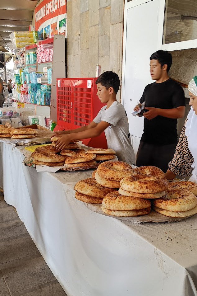A family selling non bread in the chorsu bazaar in Tashkent, Uzbekistan