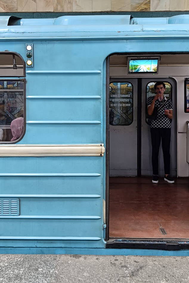 A blue train on the metro line in Tashkent