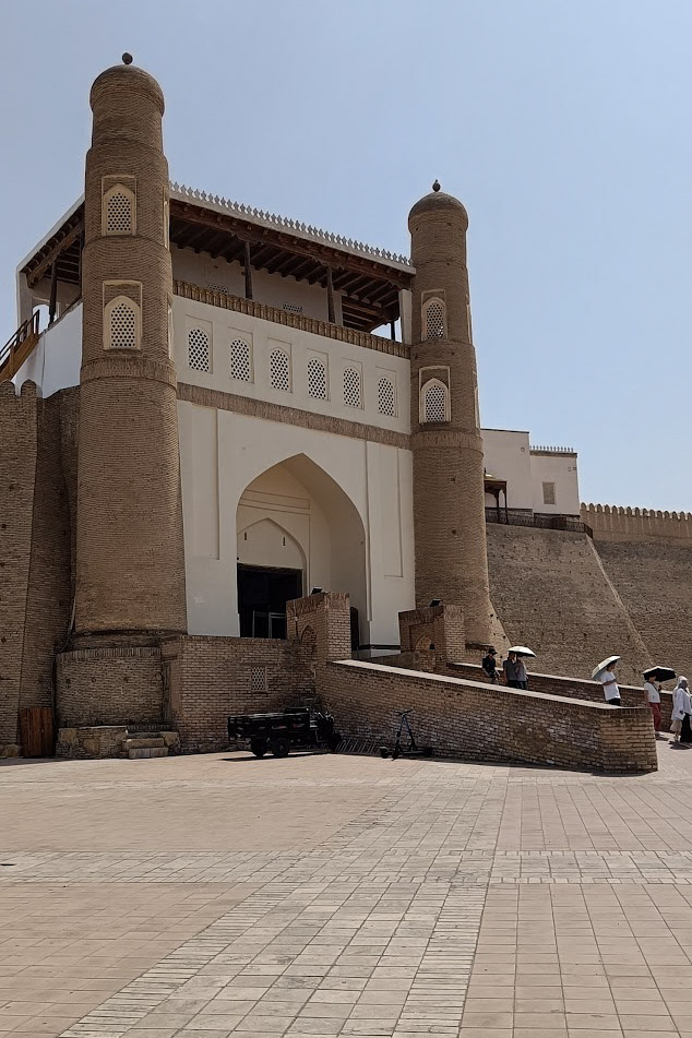 A close up image of the entrance to the Ark of Bukhara, a big gate with a ramp up to it