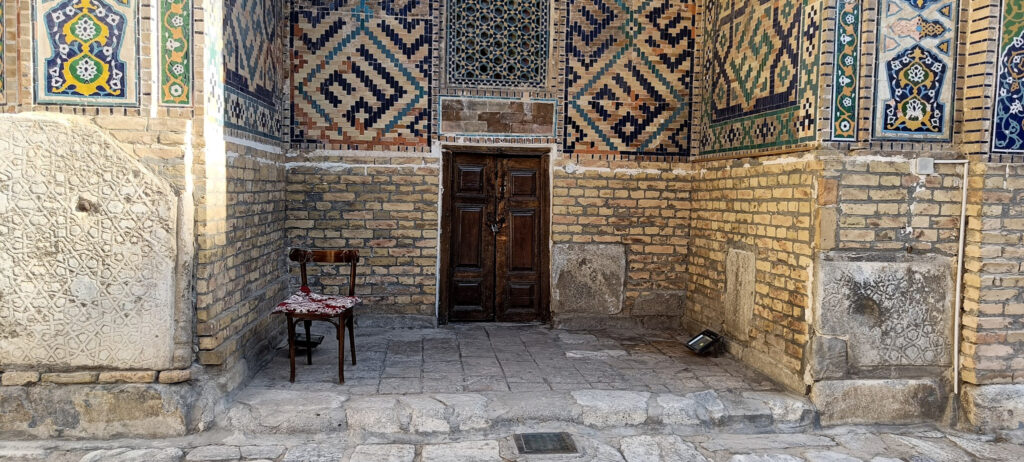 A chair outside a door in Samarkand, Uzbekistan
