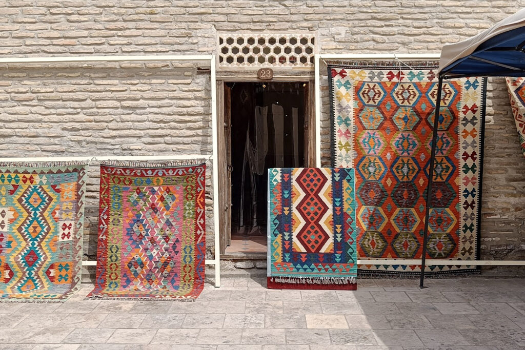 Carpets for sale outside a shop in Bukhara