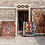 Carpets for sale outside a shop in Bukhara. Uzbekistan packing list.