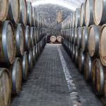 A row of wine barrels in the Bagizagan winery in Samarkand, Uzbekistan