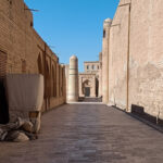A street in Khiva with shops and a minaret, one of the many things to do in Khiva
