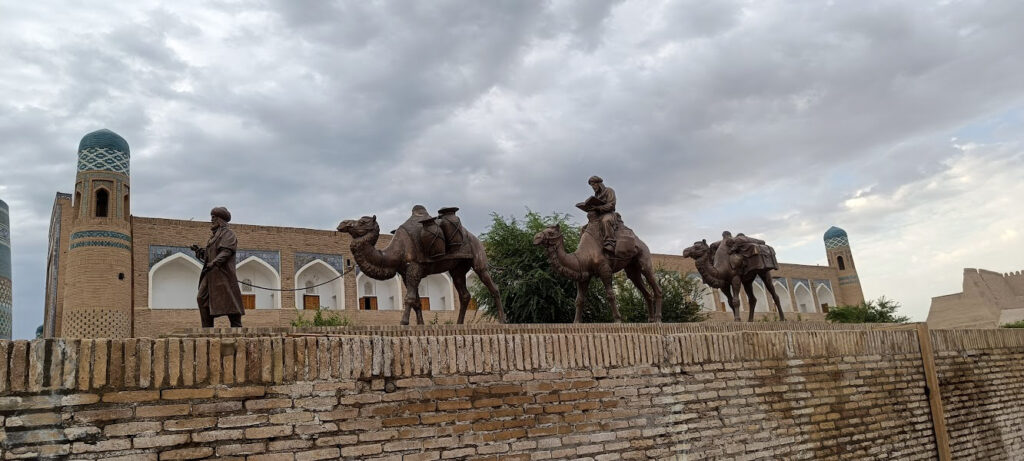 A statue in Khiva showing a caravan of camels
