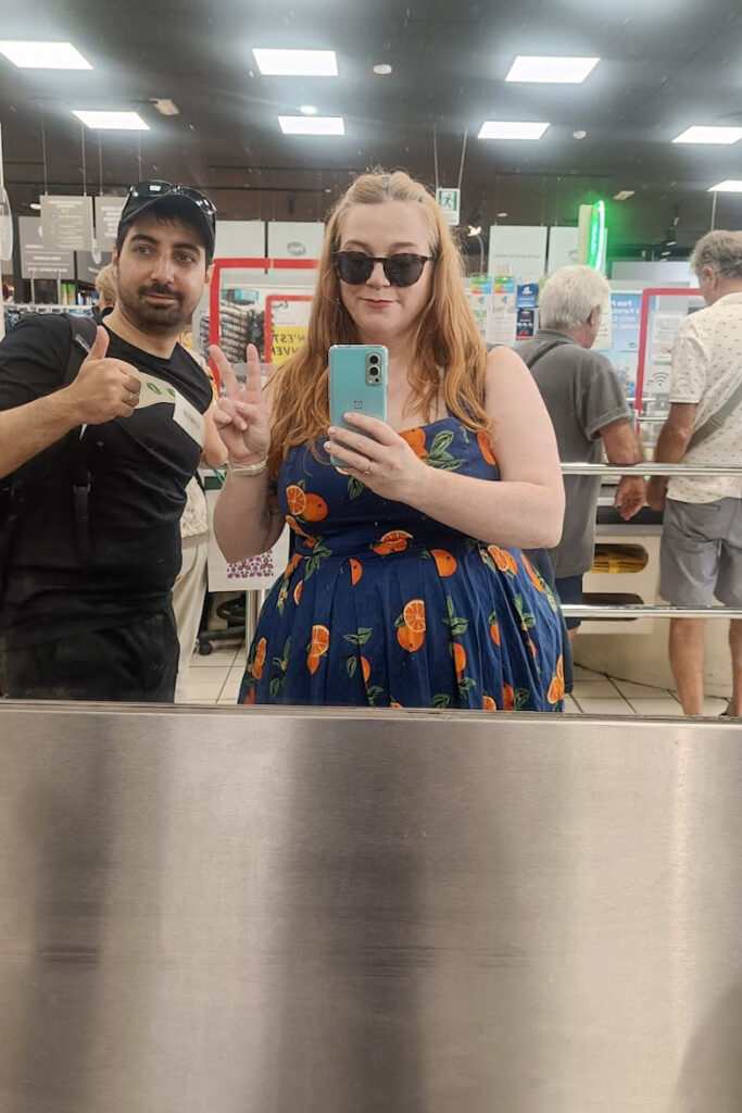 Two people at a supermarket till in Verona, Italy