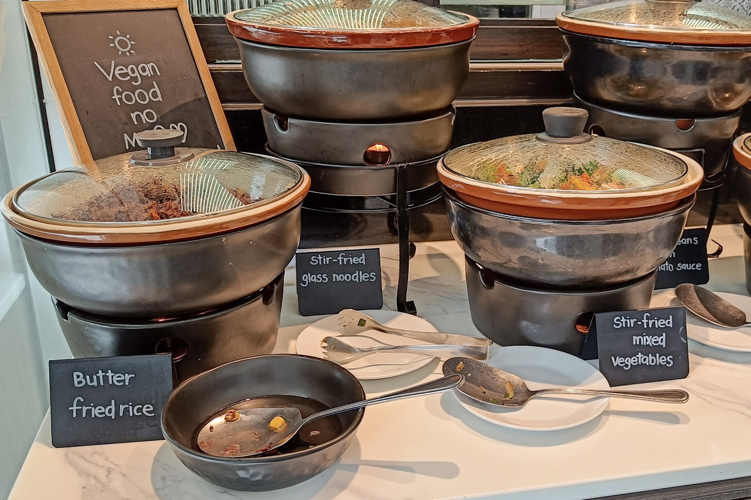 Buffet display of vegan dishes