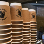 Coffee cups printed with the Akha Ama Coffee logo in chiang mai