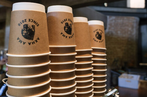 Coffee cups printed with the Akha Ama Coffee logo in chiang mai