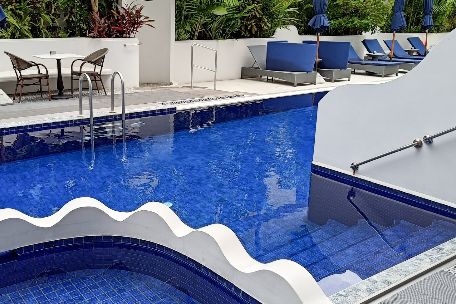 Modern pool with blue tiles in Away Chiang Mai hotel