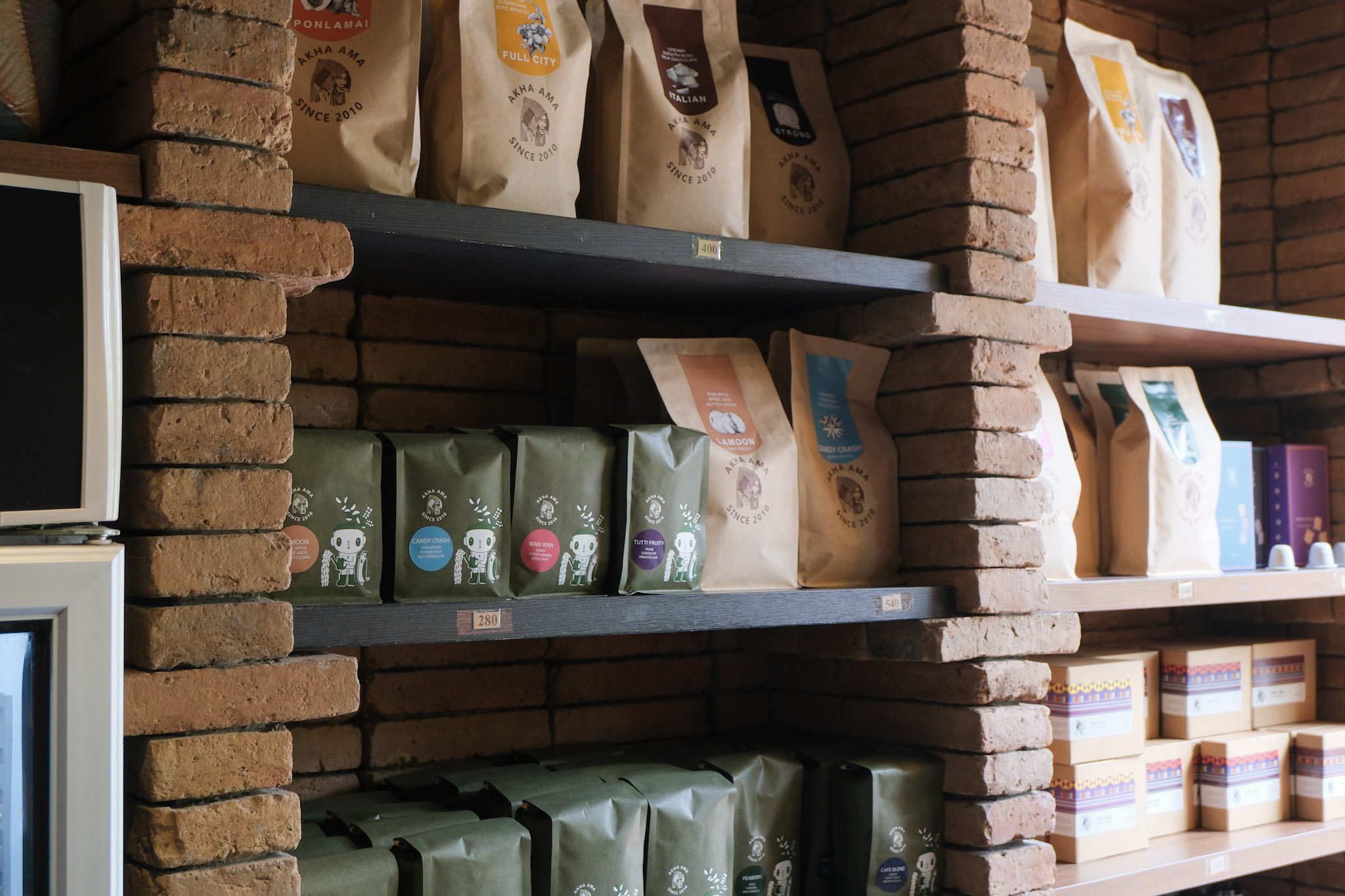 Shelves of beans of coffee for sale in Akha Ama Coffee