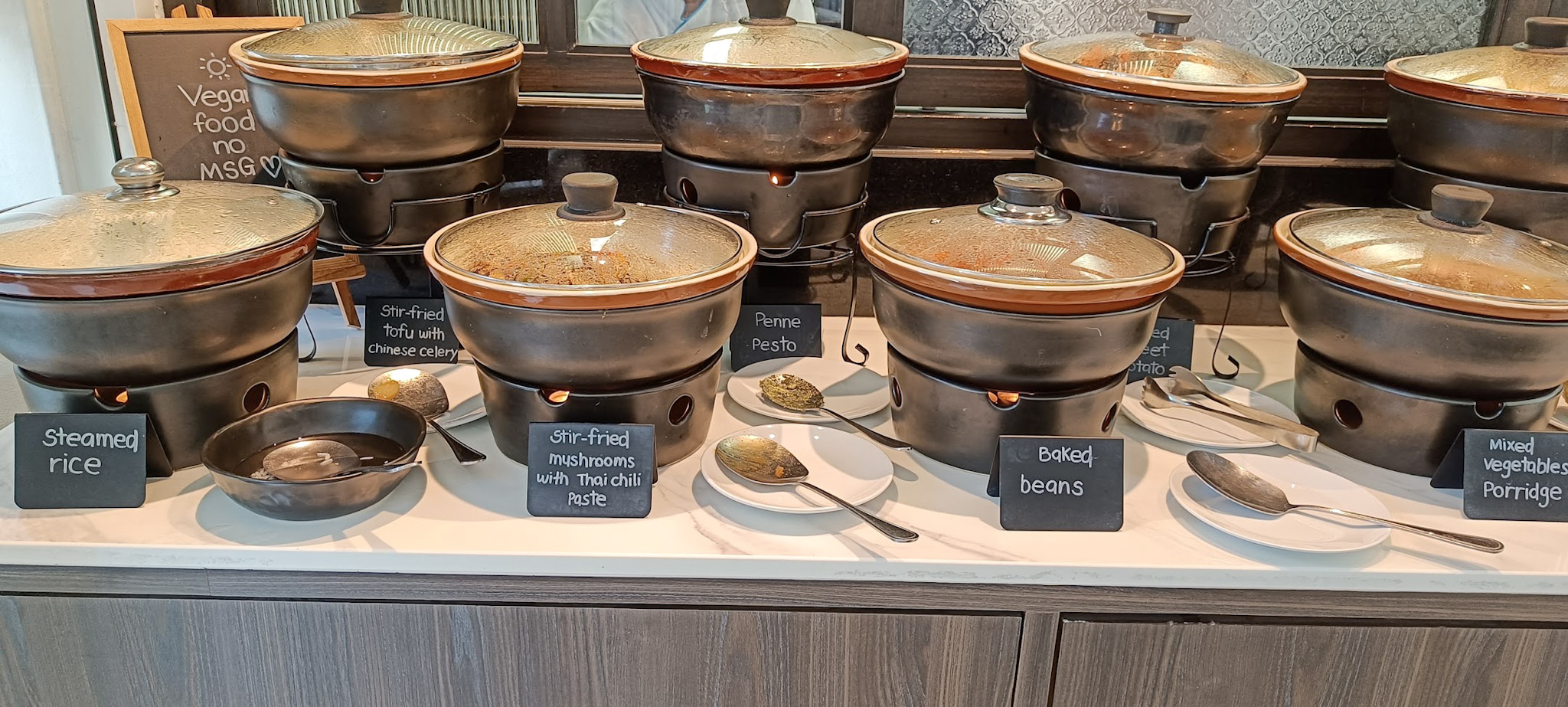 Buffet with various vegan food options in Away Chiang Mai