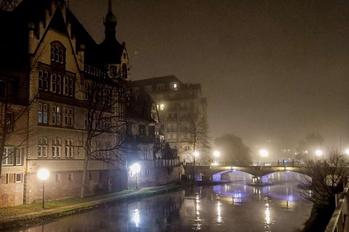 Fog lined river and buildings in Strasbourg at Christmas
