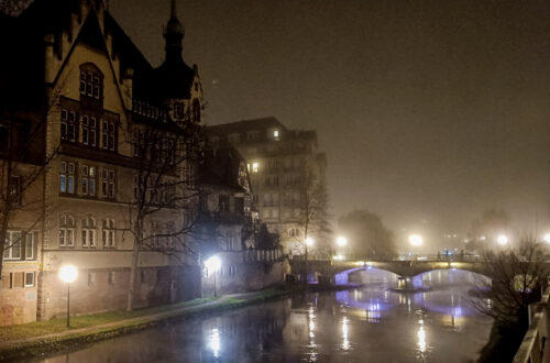 Fog lined river and buildings in Strasbourg at Christmas