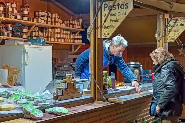 A man at a market stall at the Strasbourg Christmas Market