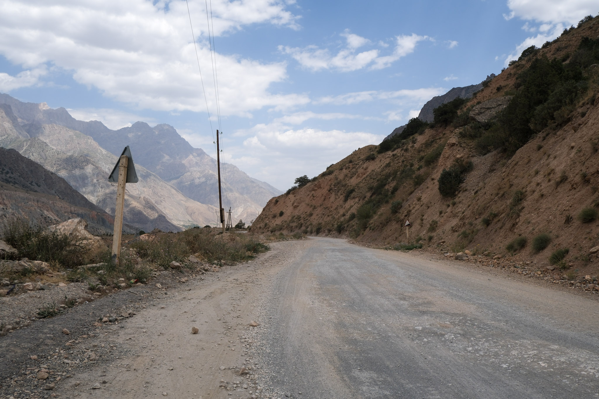 Gravel road through mountainous landscape